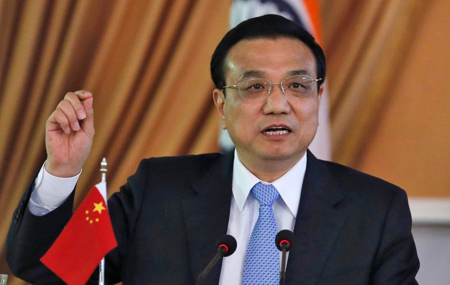 Chinese Premier Li speaks with the media during the signing of agreements ceremony with India's PM Singh in New Delhi